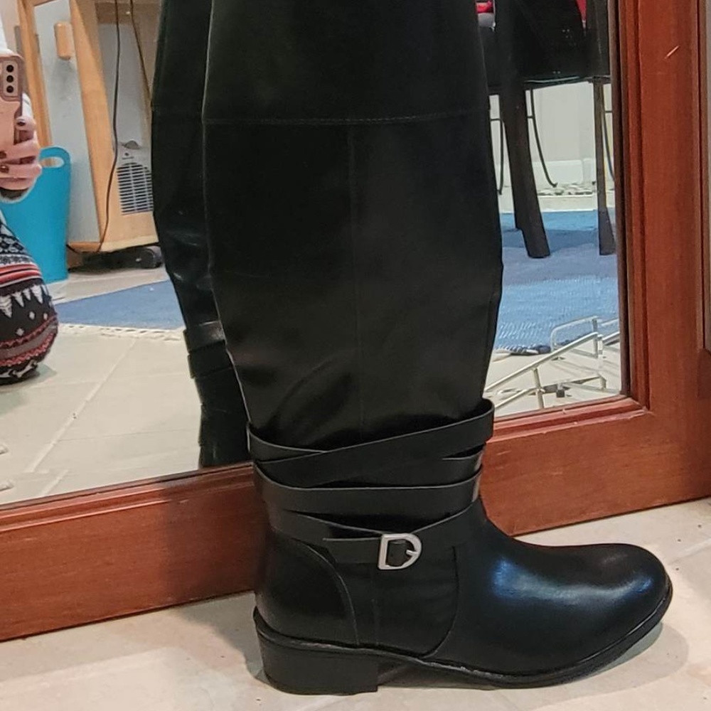 Black boot with straps.